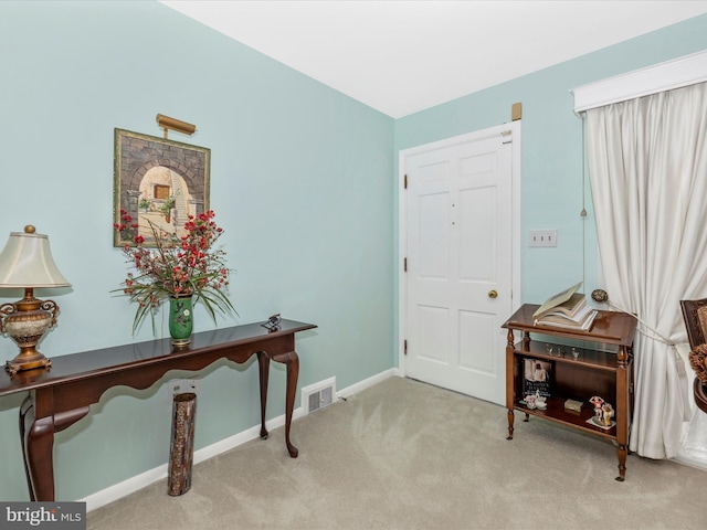 view of carpeted foyer