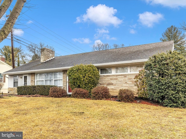 view of side of property with a lawn