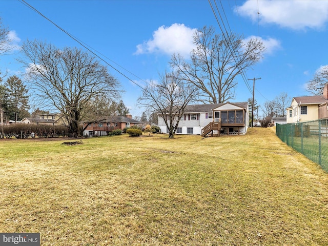 view of yard featuring a sunroom