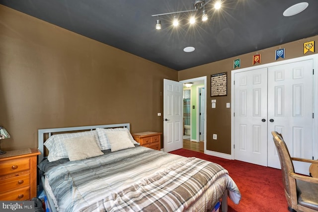 carpeted bedroom with a closet