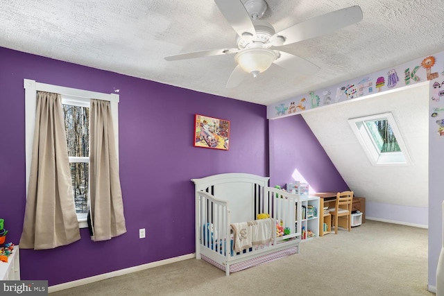 bedroom with ceiling fan, multiple windows, a nursery area, and carpet