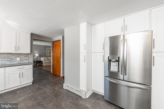 kitchen featuring white cabinetry, a baseboard heating unit, backsplash, and stainless steel fridge with ice dispenser