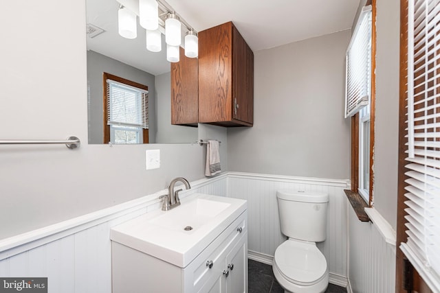 bathroom with vanity and toilet