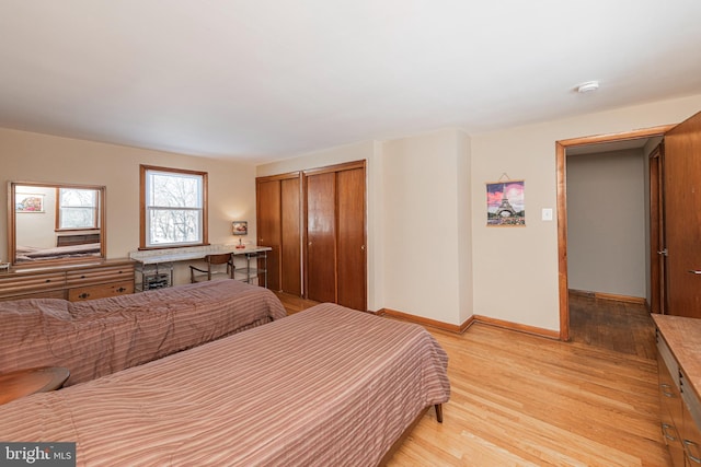 bedroom featuring light hardwood / wood-style floors and a closet