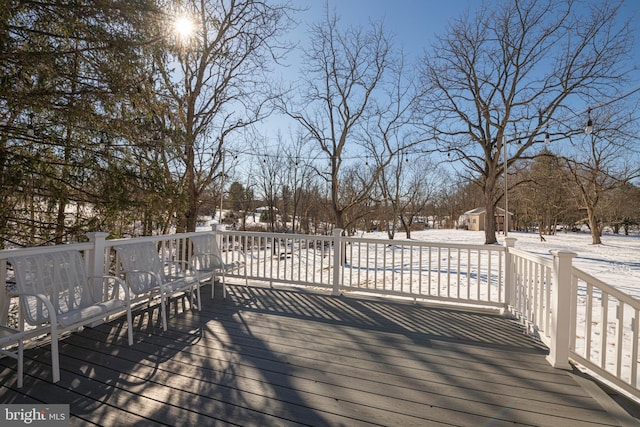 view of snow covered deck