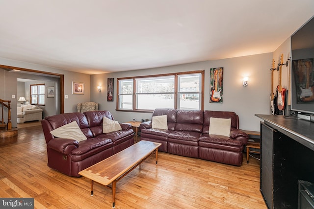 living room with light hardwood / wood-style flooring