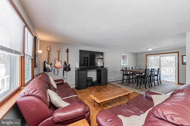 living room with hardwood / wood-style floors and baseboard heating