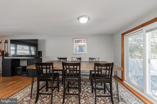 dining area with hardwood / wood-style floors