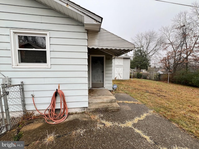 entrance to property with a yard