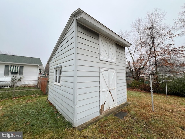 view of outdoor structure featuring a yard