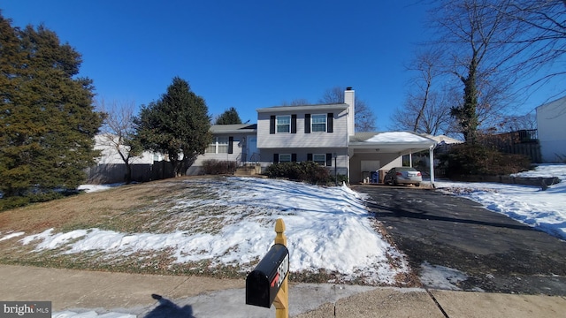 split level home with a carport