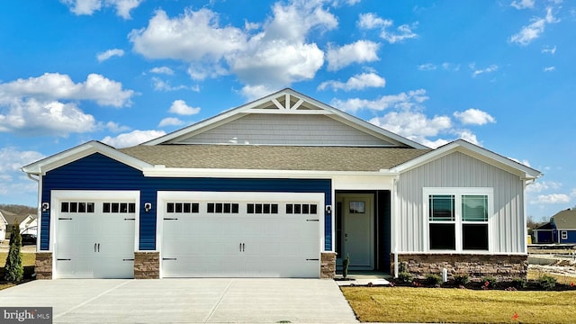 craftsman inspired home featuring a garage and a front lawn