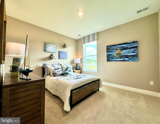 bedroom with light carpet