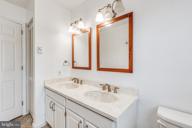 bathroom with toilet and vanity