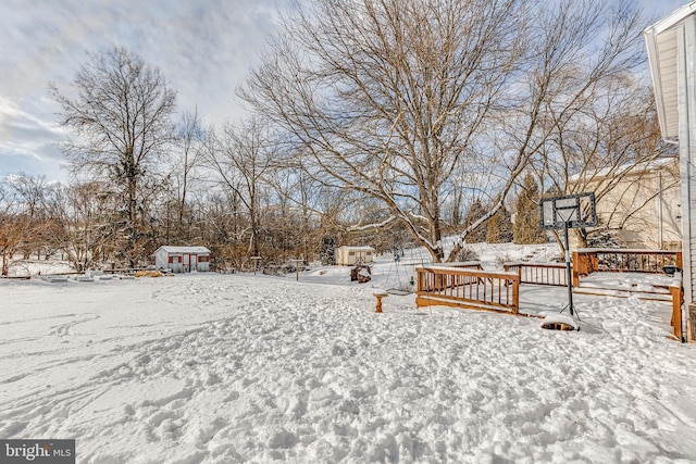 view of yard layered in snow