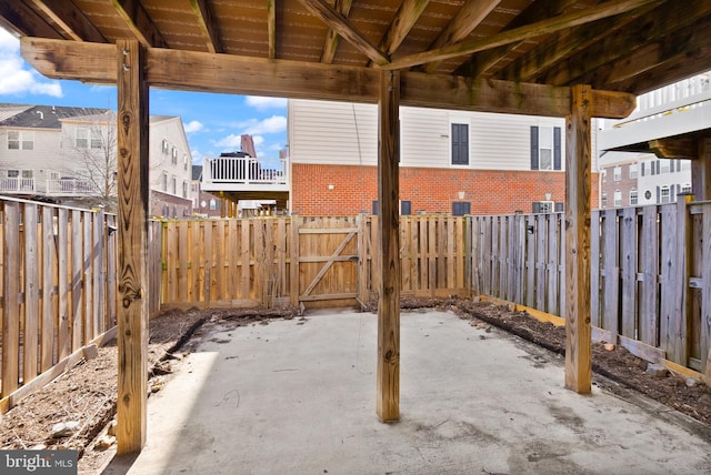 view of patio featuring a fenced backyard and a gate