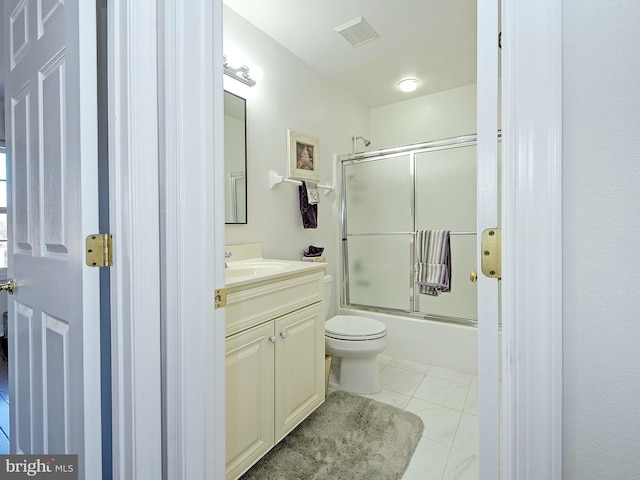 full bathroom with toilet, tile patterned floors, vanity, and enclosed tub / shower combo