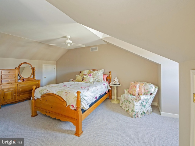 carpeted bedroom featuring ceiling fan and vaulted ceiling