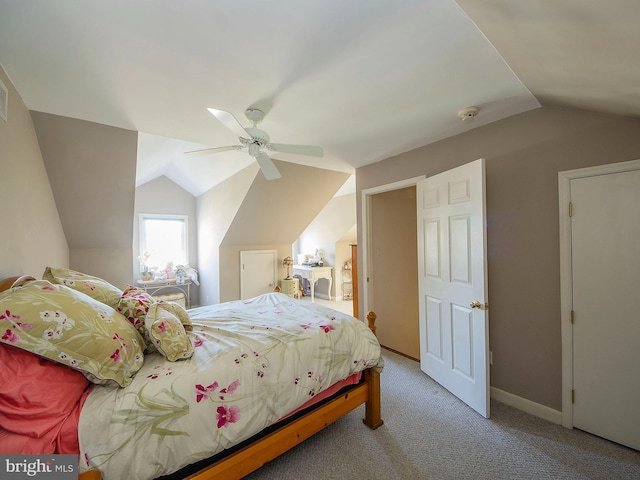 bedroom featuring ceiling fan, carpet, and vaulted ceiling