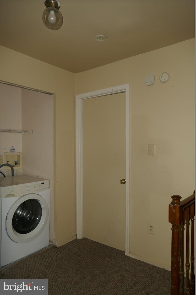 washroom featuring washer / dryer and carpet flooring