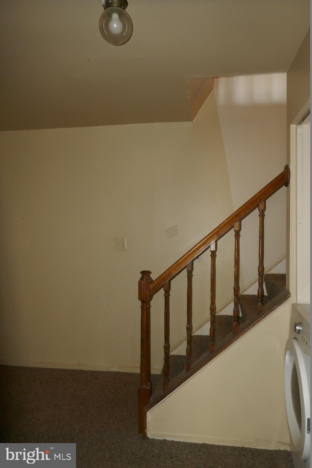 stairs featuring washer / clothes dryer and carpet flooring