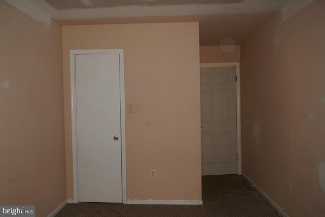 unfurnished bedroom featuring carpet flooring