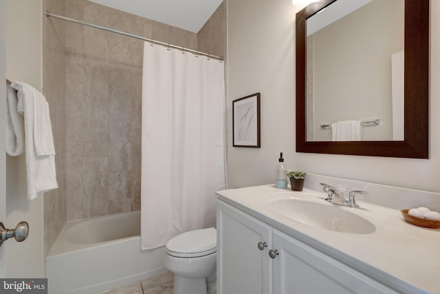 bathroom featuring shower / tub combo with curtain, vanity, toilet, and tile patterned floors