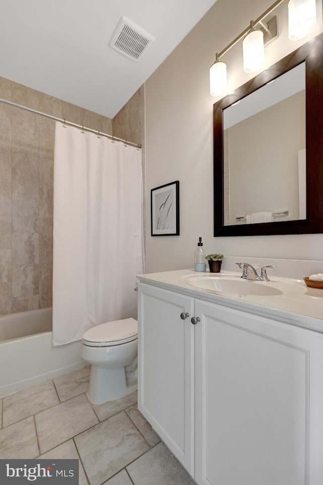 bathroom with visible vents, shower / tub combo with curtain, vanity, and toilet