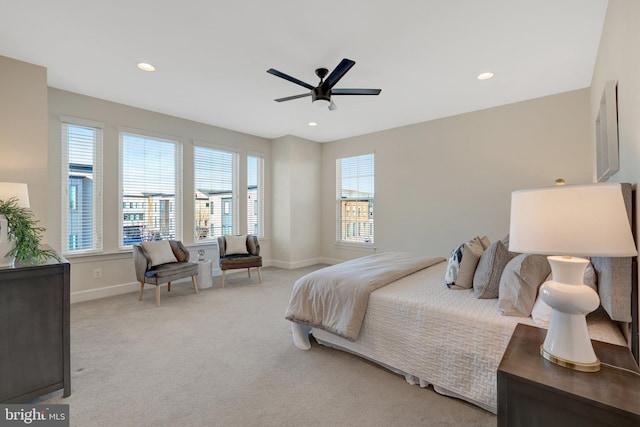 bedroom featuring light carpet, ceiling fan, baseboards, and recessed lighting