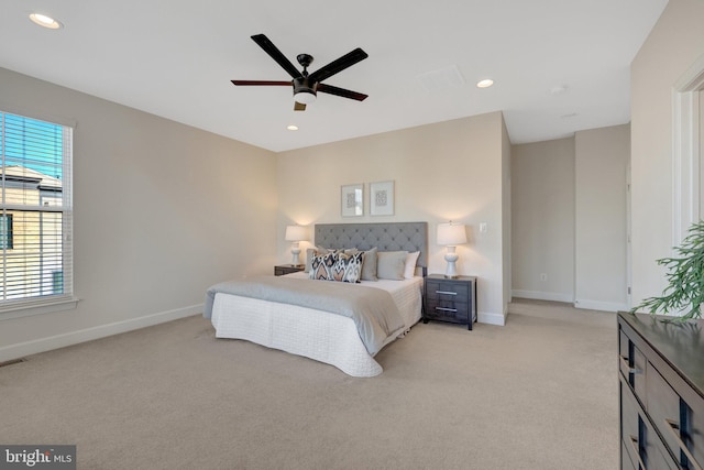 bedroom featuring baseboards, light colored carpet, and recessed lighting