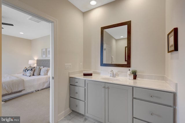 bathroom with marble finish floor, recessed lighting, visible vents, ensuite bathroom, and vanity