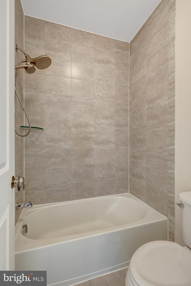 full bathroom featuring  shower combination and toilet