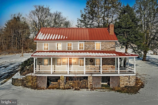 country-style home featuring a porch