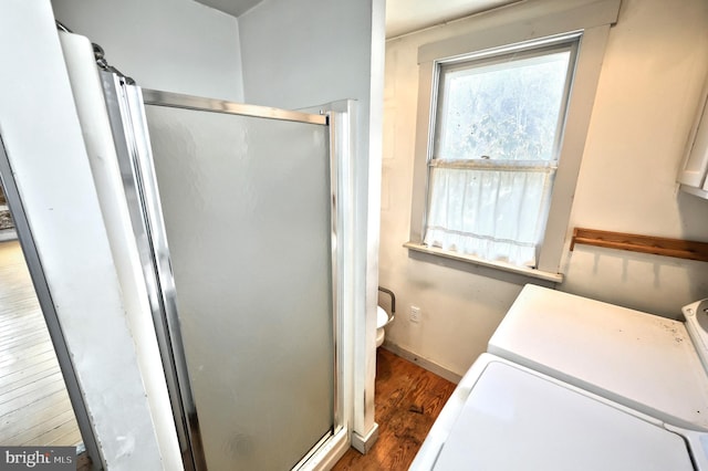 bathroom with walk in shower and wood-type flooring