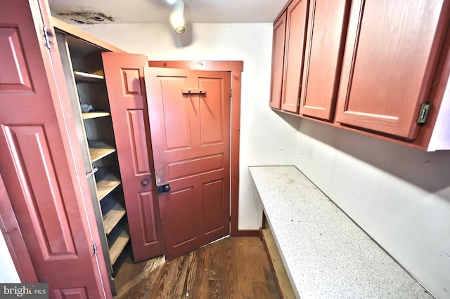 interior space with dark hardwood / wood-style floors