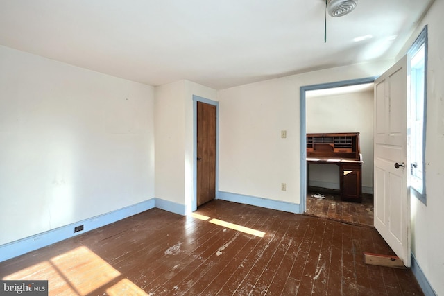 unfurnished bedroom featuring dark hardwood / wood-style floors