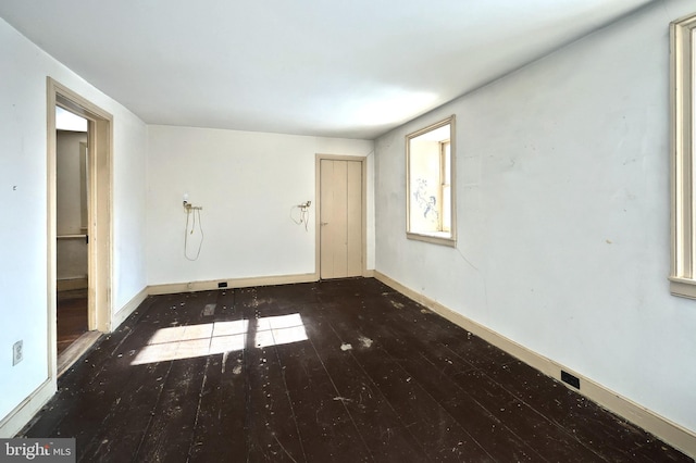 empty room featuring dark hardwood / wood-style floors