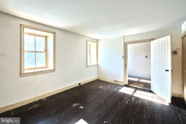 spare room featuring hardwood / wood-style floors