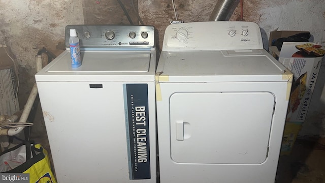 washroom with washing machine and clothes dryer