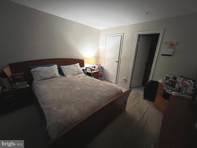 bedroom with light carpet