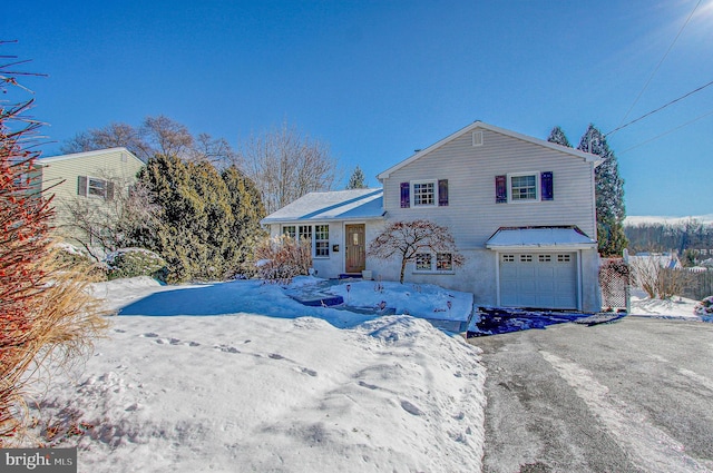 front of property with a garage