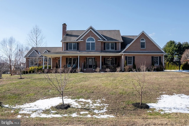 view of front facade featuring a yard and a porch