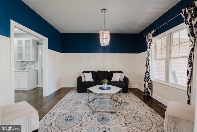 living room with dark hardwood / wood-style flooring