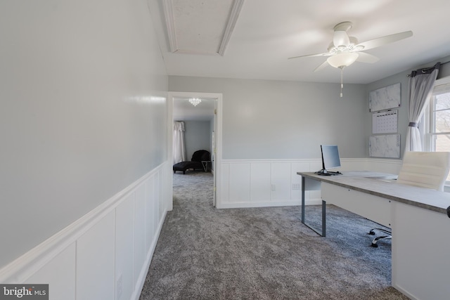 carpeted office space with ceiling fan