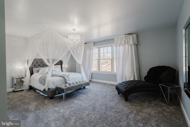 bedroom with an inviting chandelier and carpet