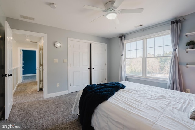 carpeted bedroom with a closet and ceiling fan