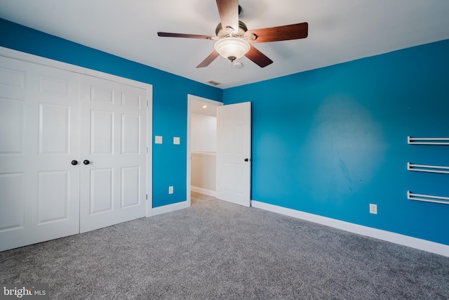 unfurnished bedroom with a closet, ceiling fan, and carpet