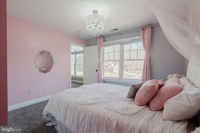 bedroom with a notable chandelier and carpet