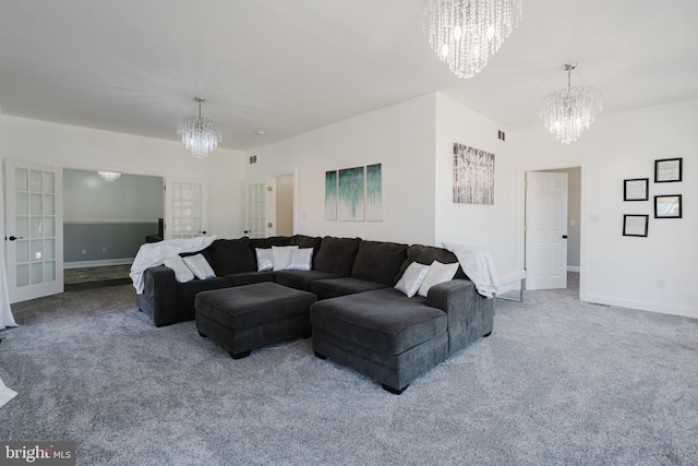 living room with french doors, carpet flooring, and a notable chandelier