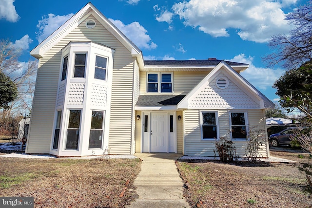 view of front of home with a front lawn